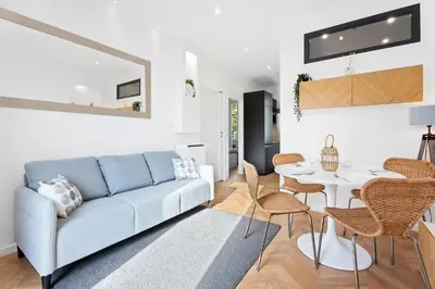 a living room with a couch and a table at Nice Renting - MAETERLINCK - Idyllic Luxury Retreat in Cap de Nice Sea View in Nice