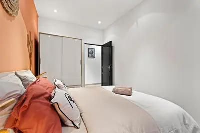 a bedroom with a large bed with white sheets at Nice - Renting - LASCARIS - Charm & Spacious & Comfort 3P Port Bonaparte in Nice
