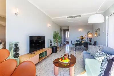 a living room with a couch and a table at PLAZA TERRACE AP4065 by RIVIERA HOLIDAY HOMES in Nice