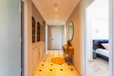 a hallway with a room with a bed and a mirror at PLAZA TERRACE AP4065 by RIVIERA HOLIDAY HOMES in Nice