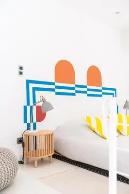 a bedroom with a bed and a table at Duplex au cœur du vieux Nice in Nice