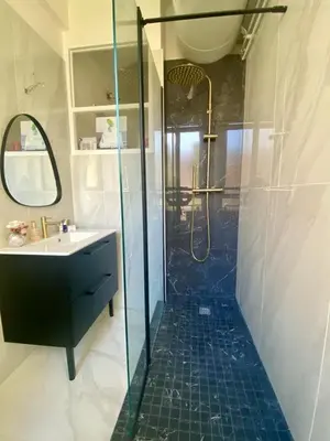a bathroom with a shower and a sink at Charming studio overlooking a beautiful garden in Nice