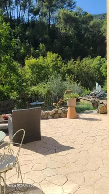 a beehive sitting in a garden next to a bush at La Laghetanne, idéalement située entre Nice et Monaco Maison Indépendante Voiture indispensable in La Trinité