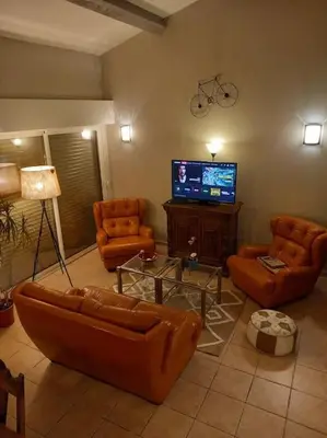 a living room with couches and a flat screen tv at La Laghetanne, idéalement située entre Nice et Monaco Maison Indépendante Voiture indispensable in La Trinité