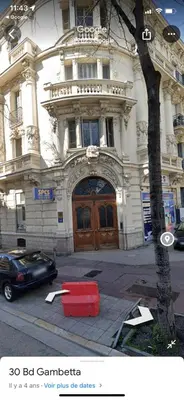 a building with a red container in front of it at Appartement T2 coconing, WIFI, INTERNET, CLIM, 300m plage in Nice