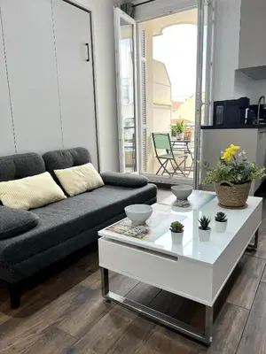 a living room with a couch and a coffee table at Studio centre ville de Nice à 200m de la plage in Nice