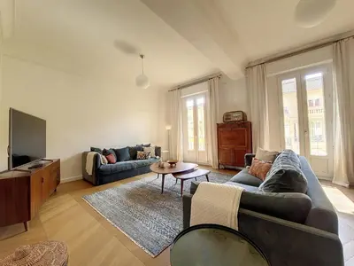 a living room with a couch and a tv at Nestor&Jeeves - BELLE EPOQUE - Central, Close sea in Nice