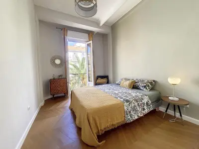 a bedroom with a bed and a window at Nestor&Jeeves - BELLE EPOQUE - Central, Close sea in Nice