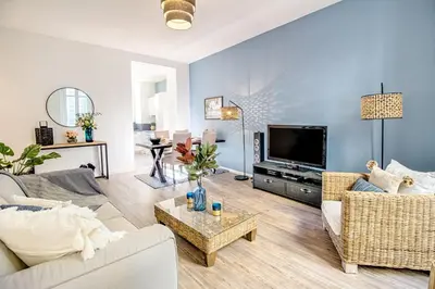 a living room with a couch and a tv at Nestor&Jeeves - ADRIANA - Central, Close sea in Nice