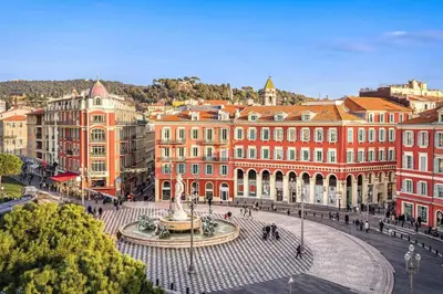 a city square with a fountain in front of buildings at Nestor&Jeeves - ADRIANA - Central, Close sea in Nice
