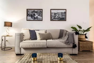 a living room with a couch and three pictures on the wall at Nestor&Jeeves - ADRIANA - Central, Close sea in Nice
