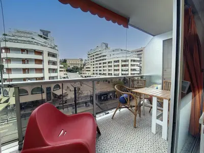 a balcony with a red chair and a table at Nestor&Jeeves - FLORIDA BEACH - Studio with balcony in Nice