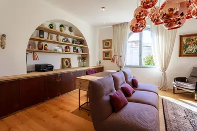a living room with a couch and a table at Luxury Villa Nice in Nice