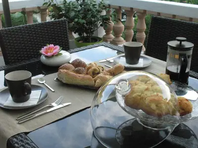 a table with a glass bowl of food on it at Villa Bellabé in Nice