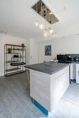 a kitchen with a counter top in a room at Le calme à Nissa la Bella in Nice