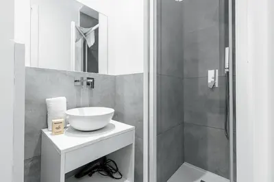 a bathroom with a sink and a shower at Garibaldi Square - Cozy 1 Bdr Old Town in Nice