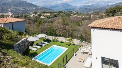 an aerial view of a small white house with a pool at Villa Riviera - Nouveaute entre mer et montagnes in Colomars