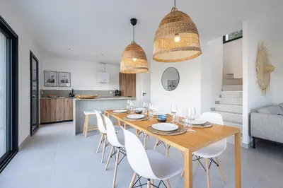 a kitchen and dining room with a table and chairs at Villa Riviera - Nouveaute entre mer et montagnes in Colomars