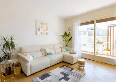 a white living room with a white couch and a window at 2Bed 2Bath Sea View Promenade Bright & Spacious! BRAVOSTAYSRIVERIA in Nice