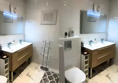 a bathroom with two sinks and a toilet at 2Bed 2Bath Sea View Promenade Bright & Spacious! BRAVOSTAYSRIVERIA in Nice