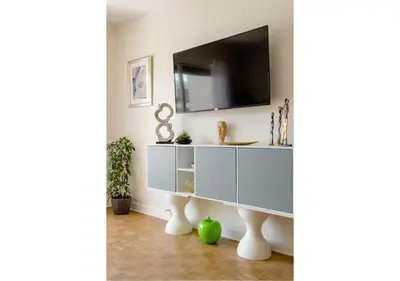 a white entertainment center with a tv on a wall at 2Bed 2Bath Sea View Promenade Bright & Spacious! BRAVOSTAYSRIVERIA in Nice