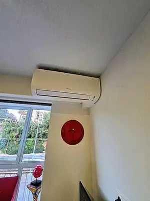 a ceiling with a red clock on a wall at Côte d'Azur Oasis Suites in Nice