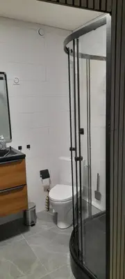 a bathroom with a toilet and a glass shower at Chez Roland in Nice