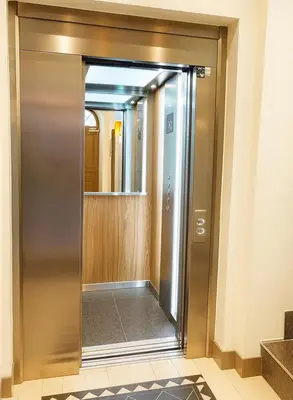 an elevator door in a building with a mirror at Modern apartment with AC near Old Nice & Beach in Nice