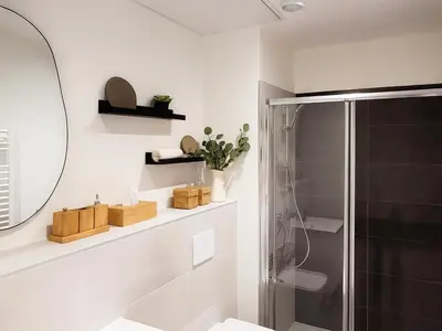 a bathroom with a shower and a mirror at Modern apartment with AC near Old Nice & Beach in Nice