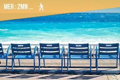 a group of blue chairs on the beach at Appartements Nice Centre Proche Mer Carré d'Or in Nice
