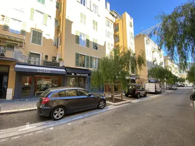 a car parked on the side of a city street at Lovely 2 Bdr Nice Harbor in Nice