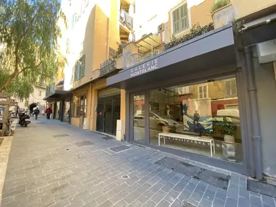 a street with a store with a sign on it at Lovely 2 Bdr Nice Harbor in Nice