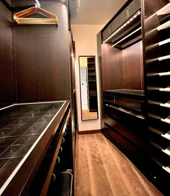 a kitchen with dark wood cabinets and a mirror at Apartment Malaussena - Reception 24&7 - Center Libération in Nice