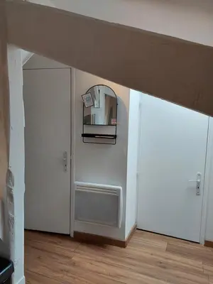 a room with two white doors and a mirror at Loft Cosy NICE centre ville in Nice