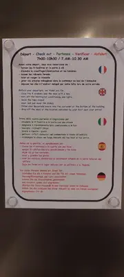 a sign that is hanging on a wall at Loft Cosy NICE centre ville in Nice