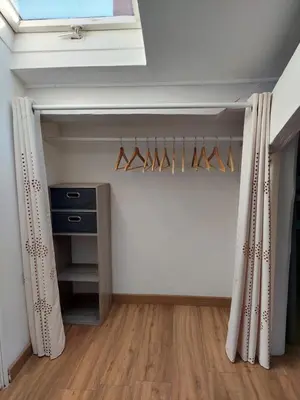 a room with a closet with hangers and a window at Loft Cosy NICE centre ville in Nice