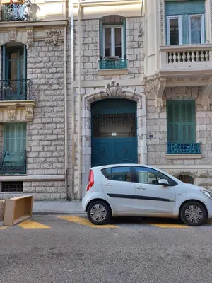 a silver car parked in front of a building at Loft Cosy NICE centre ville in Nice