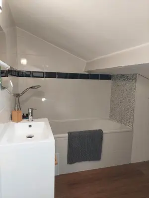 a bathroom with a sink and a bath tub at Loft Cosy NICE centre ville in Nice