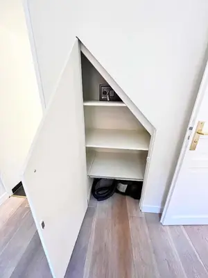 an attic room with a closet under the stairs at Elegant flat with AC, heart of old Nice, Walking to the Beach! in Nice