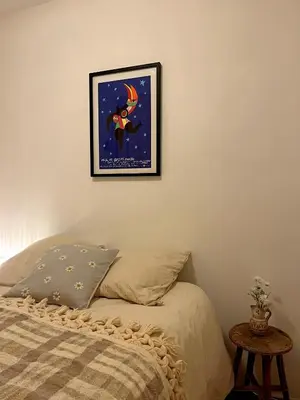 a bedroom with a bed and a picture on the wall at Casa Marguerite, studio atypique in Nice