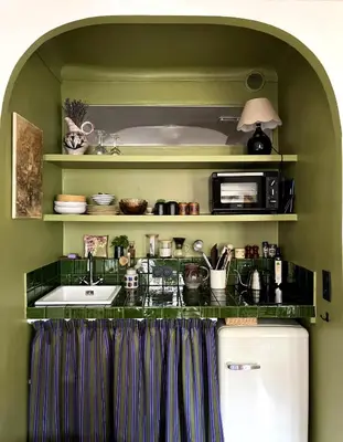 a kitchen with a sink and a microwave at Casa Marguerite, studio atypique in Nice