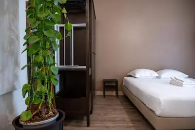 a bedroom with a bed and a plant at GuestReady - A peaceful stay near the marina in Nice
