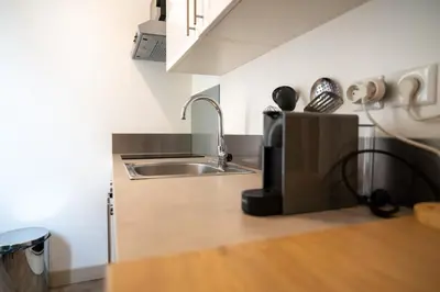 a kitchen with a sink and a counter top at GuestReady - A peaceful stay near the marina in Nice