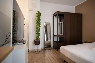 a bedroom with a bed and a dresser with a mirror at GuestReady - A peaceful stay near the marina in Nice