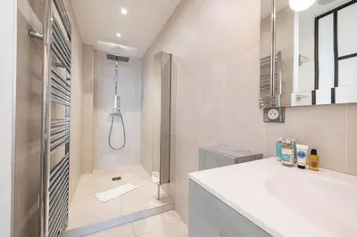 a bathroom with a shower and a sink at MY CASA - ETAT UNIS 93 INDIGO - Amazing Sea View Aprt with AC in Nice