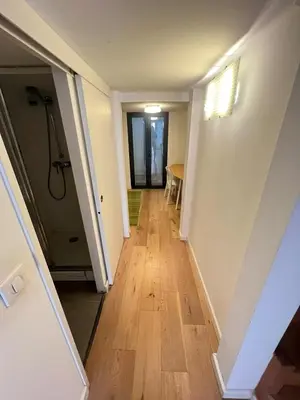 a hallway of a house with a wooden floor at Magnifique Duplex Type Loft in Nice