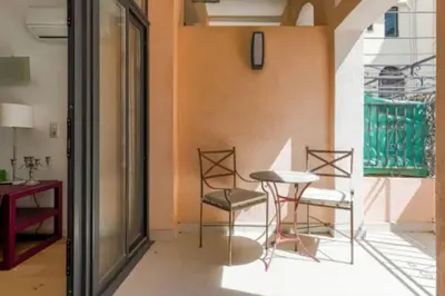a room with chairs and a table in a room at Magnifique Duplex Type Loft in Nice