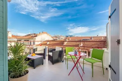 a balcony with a table and chairs and a view at MY CASA - DALPOZZO - 5min walk to beach in Nice