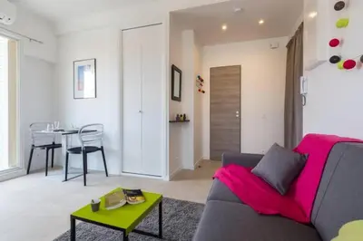 a living room with a couch and a table at MY CASA - DALPOZZO - 5min walk to beach in Nice