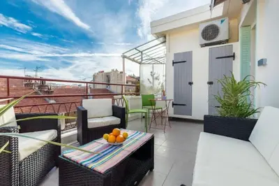 a balcony with a table and chairs on a roof at MY CASA - DALPOZZO - 5min walk to beach in Nice